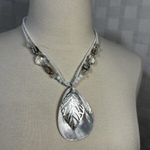 Beaded necklace double strands with shell and silver tone leaf