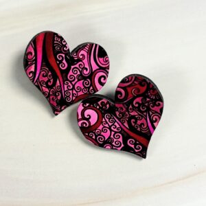 Heart shaped stud earrings, pink abstract swirl pattern