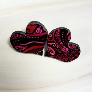 Heart shaped stud earrings, pink abstract swirl pattern