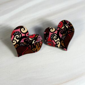 Heart shaped stud earrings, pink/cream abstract swirl pattern