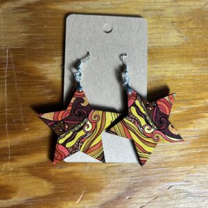 Large star dangle earrings yellow/pink/brown abstract pattern